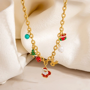 Close-up of gold Christmas necklace with Santa, reindeer, and colorful holiday charms