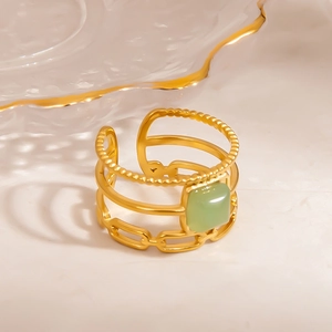 Detailed view of gold multi-layer adjustable ring with inlaid light green natural stone
