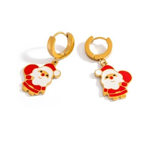 Close-up of festive gold-plated Santa Claus earrings with vibrant red and white enamel details