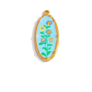 Detail of oval golden floral pendant with blue enamel and colorful flower pattern