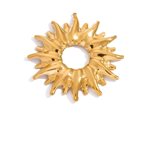 Detailed close-up of 18K gold plated sunburst pendant with radial wavy texture and mirror finish