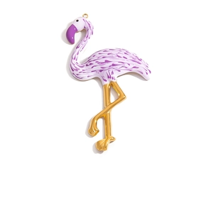 Polished 18K gold plated flamingo pendant with purple enamel details on white background