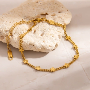 Minimalist 18K gold plated stainless steel bracelet with delicate five-petal flower charms