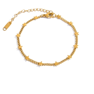 Detailed macro view of gold-plated stainless steel star charm bracelet with lobster clasp