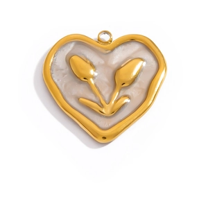 Detailed macro view of heart-shaped 18K gold-plated pendant with tulip embossing