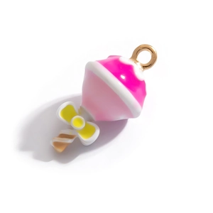 Detail of colorful enamel dessert pendant with yellow bow and 18K gold plated ring