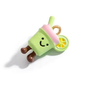 Detailed view of green drink charm with pink lid and lemon slice in enamel alloy