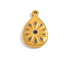 Detail of water-drop pendant with blue zircon and gold plated hollow floral pattern