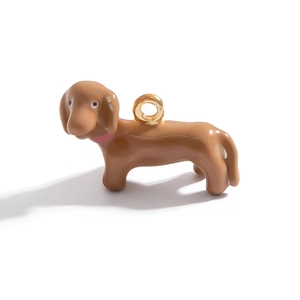 Detail of dachshund dog charm in brown enamel with pink collar and 18K gold plating