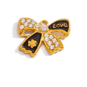 Detail of 18K gold-plated bow pendant with black enamel, rhinestones and Love engraving