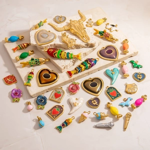 Detail of colorful enamel dripping oil charms with gold plating and sparkling rhinestones