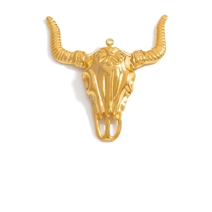 Bohemian gold-plated bull skull pendant with floral relief and spiral horns on white back