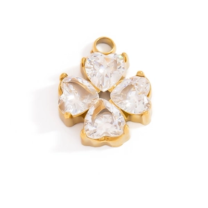 Detail of 18K gold plated four-leaf clover pendant with heart-shaped cubic zirconia