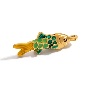 Macro shot of 18K gold plated fish pendant with green enamel scales and detailed finish