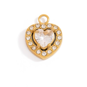 Macro view of 18K gold heart pendant with zircon inlay and sparkling claw-set gems
