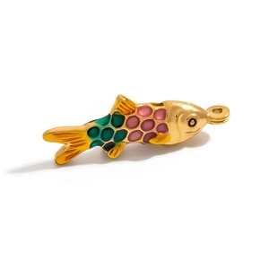 Macro shot of 18K gold plated fish charm with colorful enamel scales and bail connector