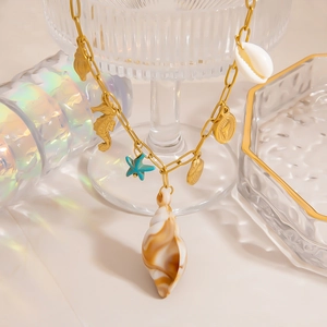 Detailed view of 18K gold-plated ocean theme necklace with starfish and shell charms