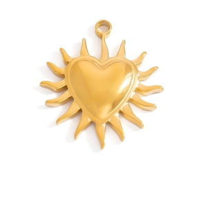 Detailed view of an 18K gold plated heart pendant with solar rays and zirconia inlay