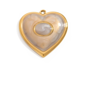 Detailed view of heart pendant with gold frame and marble texture inlay for jewelry DIY