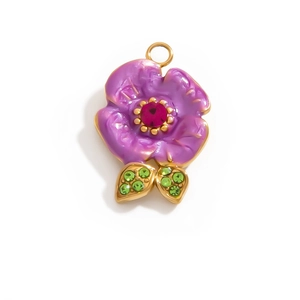 Detail of purple enamel flower charm with pink and green rhinestones and gold leaf setting