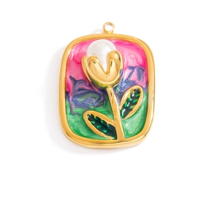Detail of 18K gold plated tulip pendant with white pearl and colorful enamel background