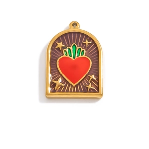 Detailed view of an enamel sacred heart pendant with gold stars on purple background