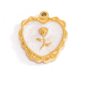 Detailed macro view of 18K gold plated heart pendant with white shell and rose inlay