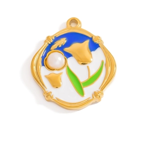 Detail view of 18K gold plated flower pendant with blue enamel and white pearl inlay