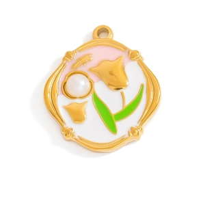 Macro shot of 18K gold plated tulip pendant with pink enamel and pearl detail