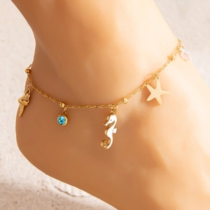 Gold stainless steel anklet featuring sea horse, starfish, shell and blue stone charms