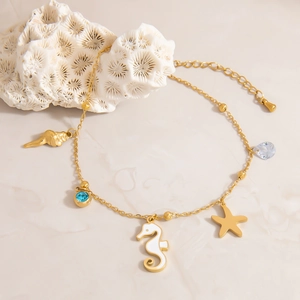 18K gold plated stainless steel anklet with seahorse starfish charms and blue zircon