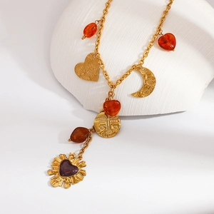 Vintage gold layered necklace with sunface coin, moon, and purple heart charms