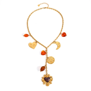 18K gold plated bohemian necklace with heart, moon, and sun charms and amber beads