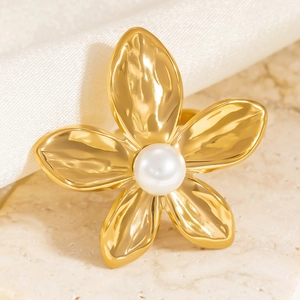 Hammered 18K gold flower ring with pearl inlay featuring unique textured metal petals