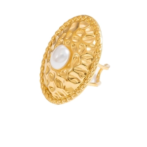 Hammered 18K gold ring with large white pearl inlay in an adjustable open band design