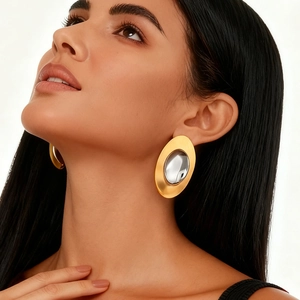 Orecchini ovali bicolore oversize in oro e argento per un look moderno e audace