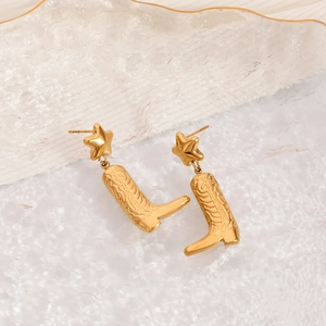 Golden cowboy boot earrings with star studs and embossed patterns in retro style