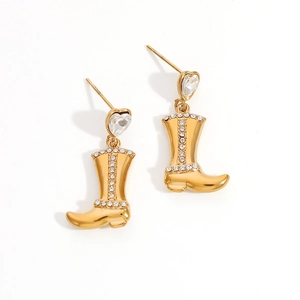 Detailed view of boot-shaped earrings with sparkling heart-shaped rhinestones and gold plating