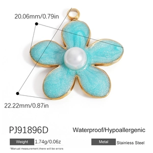 Detail view of 22mm light blue enamel flower pendant with pearl and gold plating