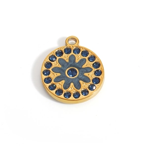 Detailed view of 18K gold pendant featuring blue floral pattern and sparkling rhinestones