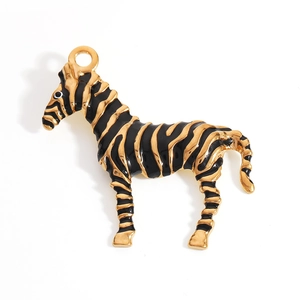 Macro shot of gold-plated zebra charm pendant with black enamel stripes and integrated ring