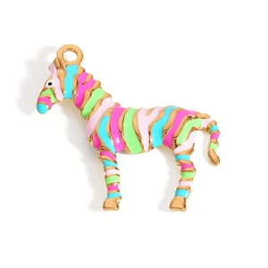 Detail of zebra shaped enamel pendant with gold trim and colorful stripes for DIY jewelry