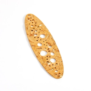 Detail of 18K gold petal cross pendant with hammered texture and irregular hollow design