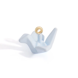 Close-up of a light blue origami crane pendant with gold loop for DIY jewelry making