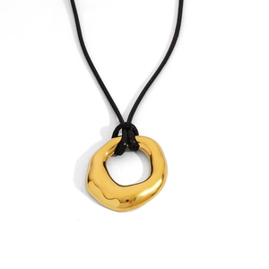 Detail showing high-polished gold lava-style pendant with minimalist black cord
