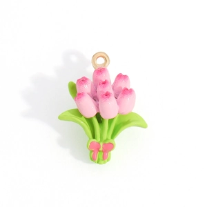 Detail of pink tulip alloy charm with green leaves and bow for DIY jewelry making