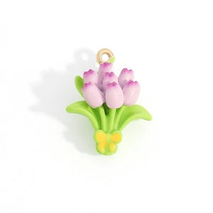 Macro shot of tulip flower bouquet pendant with enamel finish and gold ring clasp