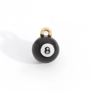 Detail of high-gloss black No. 8 billiard ball pendant with gold metal ring and enamel finish