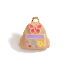 Detail of school bag charm with enamel flower patterns and gold clasp for DIY jewelry