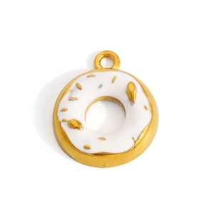Macro detail of donut charm with gold plating and white enamel for DIY jewelry making